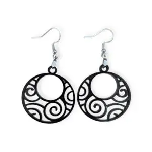 Black Laser Cut Acrylic Swirl Earrings with intricate spiral and swirl cut-out designs, featuring a hypnotic pattern inside a round silhouette, hanging from silver hooks against a white background.