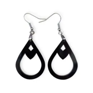 Close-up of sleek black Laser Cut Acrylic Teardrop Diamond Earrings featuring a diamond-shaped cut-out, suspended from silvertone surgical steel ear wires against a stark white background.