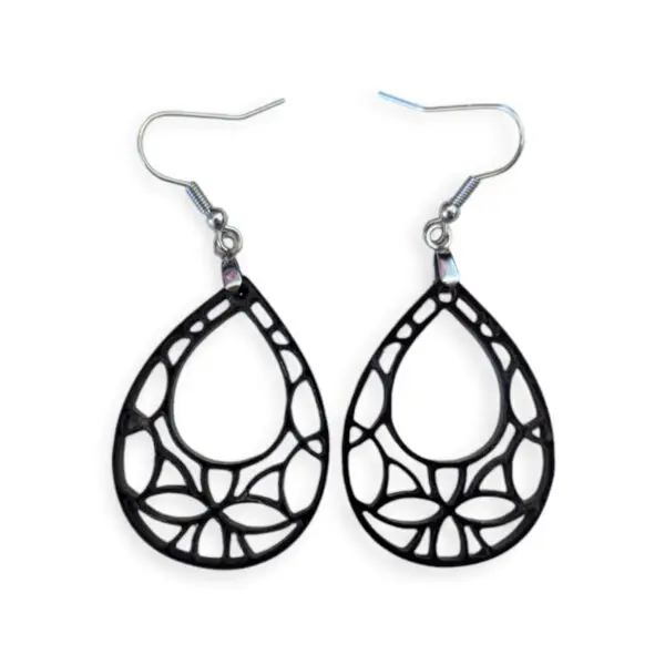 Laser Cut Acrylic Filigree Drop Earrings -- Black geometric teardrop-shaped earrings with intricate cut-out design, featuring a web-like pattern inside a teardrop silhouette, hanging from silver hooks against a white background.