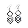 Close-up of black Laser Cut Acrylic Square Earrings featuring three interlocking square shapes, suspended from silvertone surgical steel ear wires against a white background.