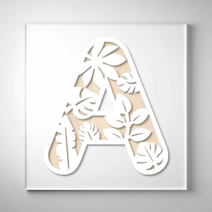 Laser-cut wooden letter "A" featuring intricate tropical foliage and leaf cutout designs over a natural wood grain background.