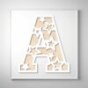 Laser-cut wooden letter "A" featuring star-shaped cutouts over a natural wood grain background.