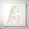 Laser-cut wooden letter "A" featuring a ballerina silhouette in an elegant pose over a light wood grain background.