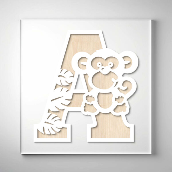 Laser-cut wooden letter "A" featuring a playful monkey and jungle leaf cutouts over a natural wood grain background.