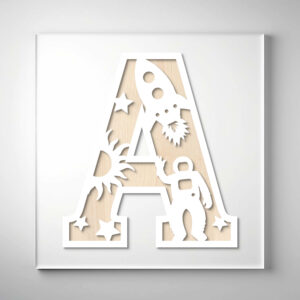 Laser-cut wooden letter "A" featuring an astronaut, rocket, sun, and stars over a natural wood grain background.